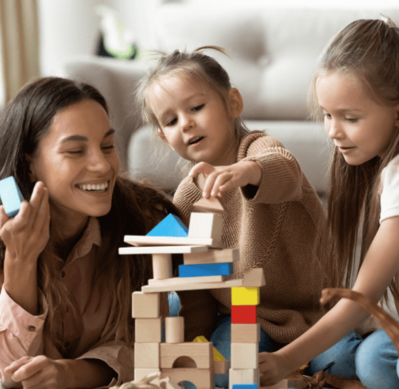 Child building a STEM bridge model with educational kit